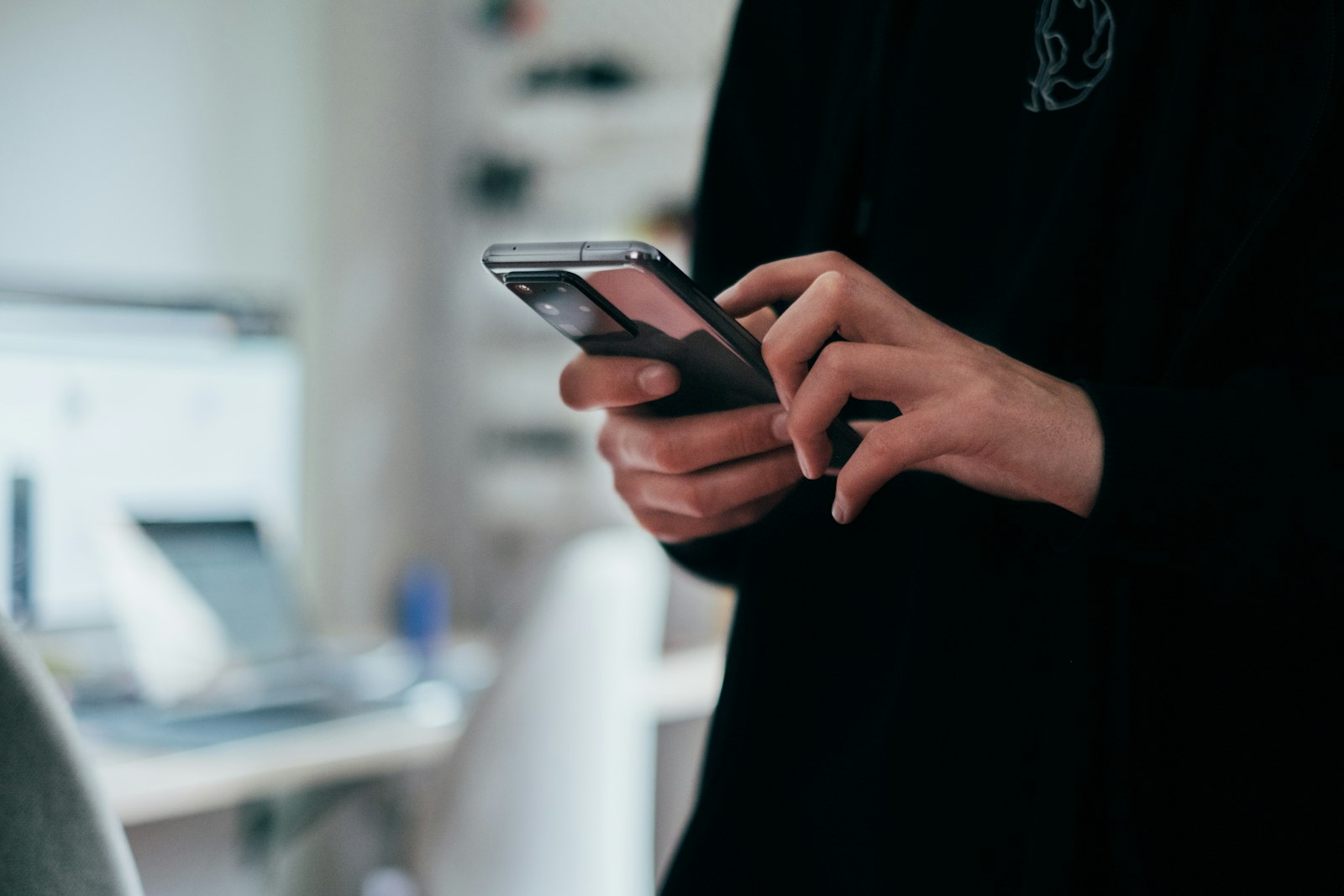 Student scrolling Reddit on a phone