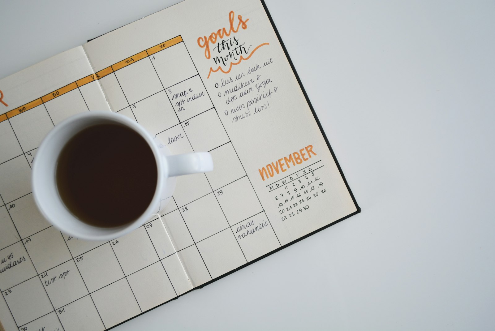 Coffee mug on an open study planner